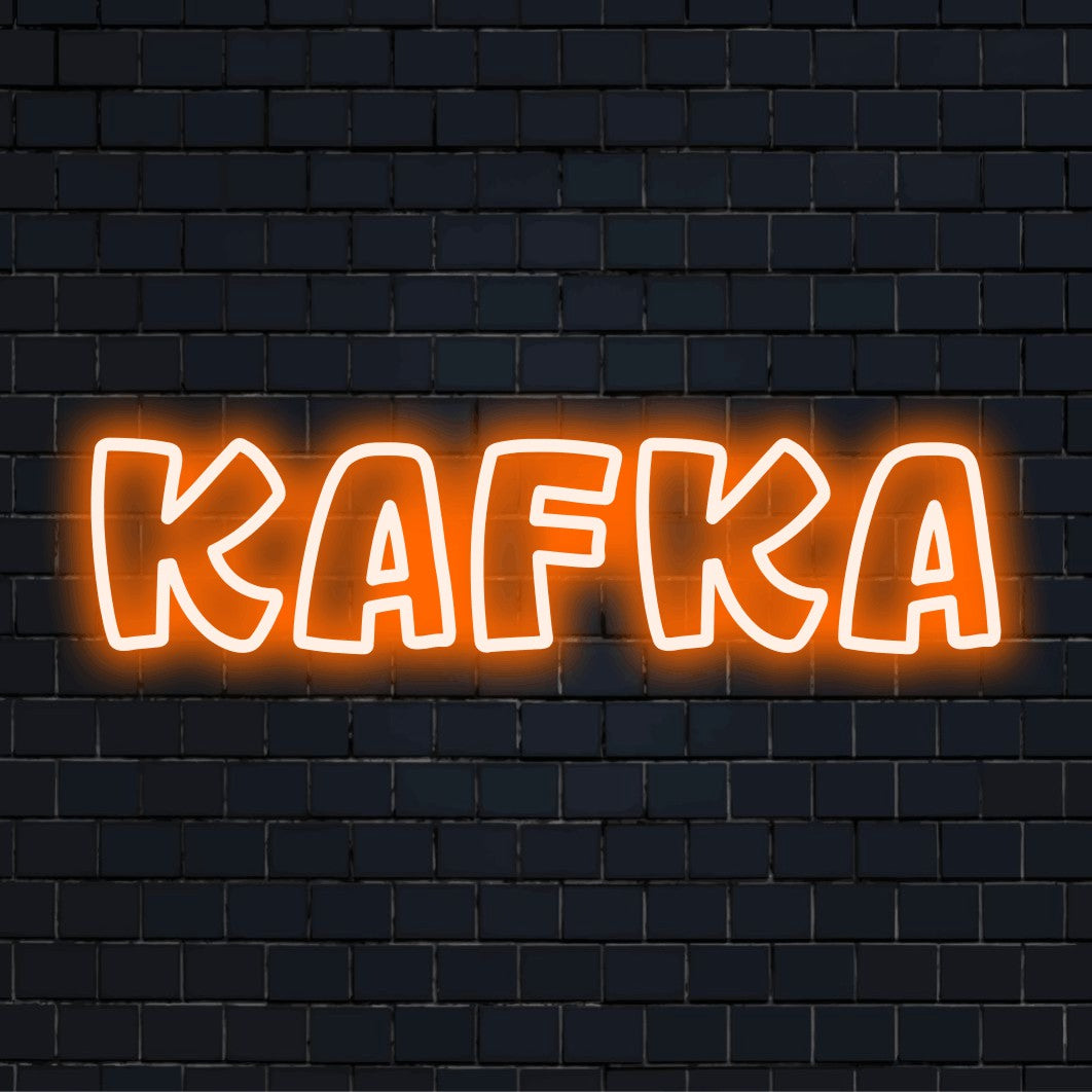 Kafka Neon Light with bright neon glow against brick backdrop