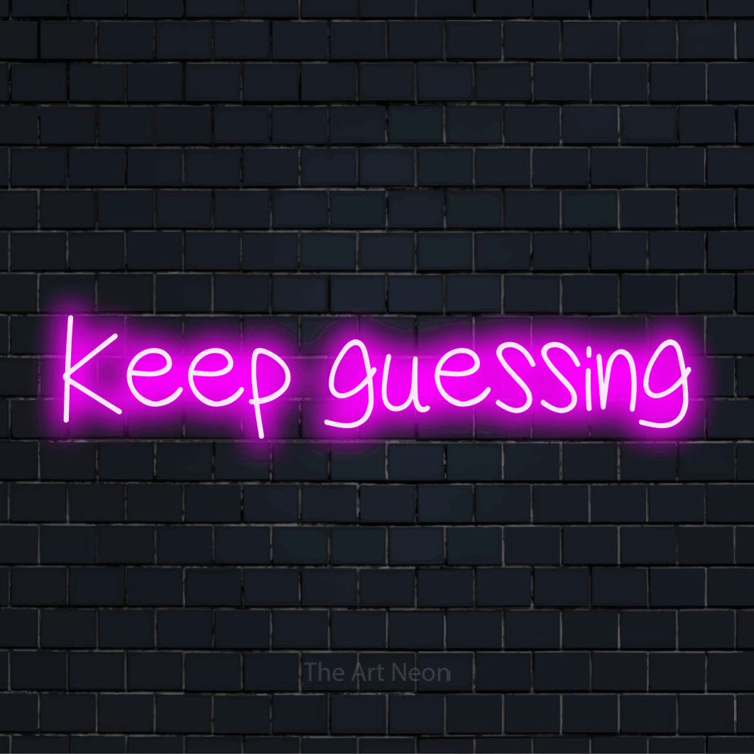 "Keep Guessing" script-style LED neon sign on a black brick wall