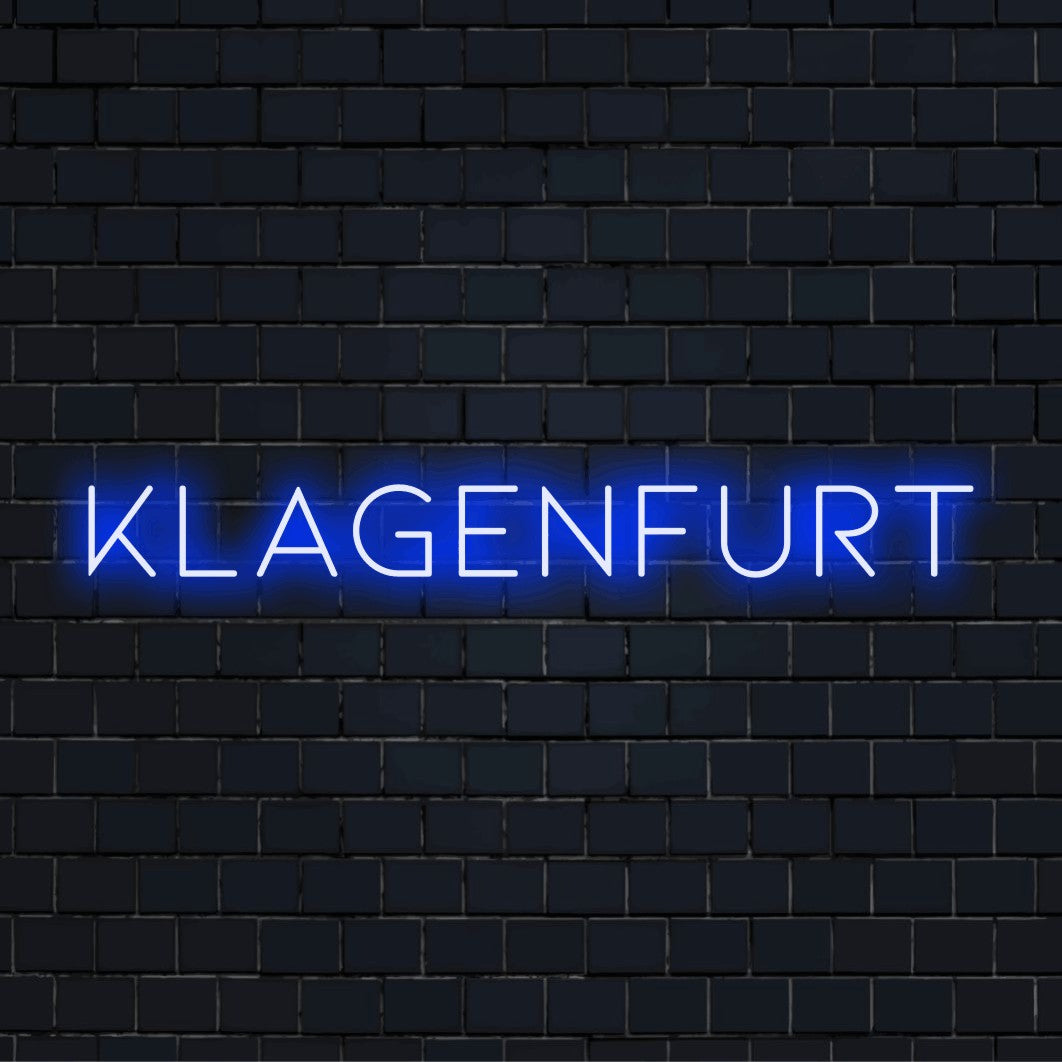 Klagenfurt Neon Light with soft neon glow on black brick background
