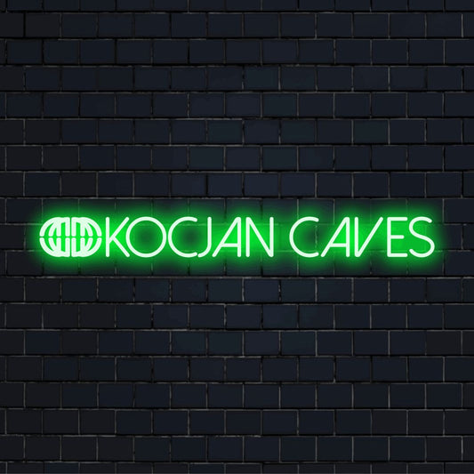 Kocjan Caves Neon Sign, neon text light on dark brick wall