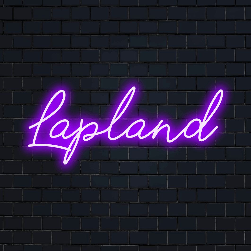 Lapland Neon Light with bright neon glow against brick backdrop