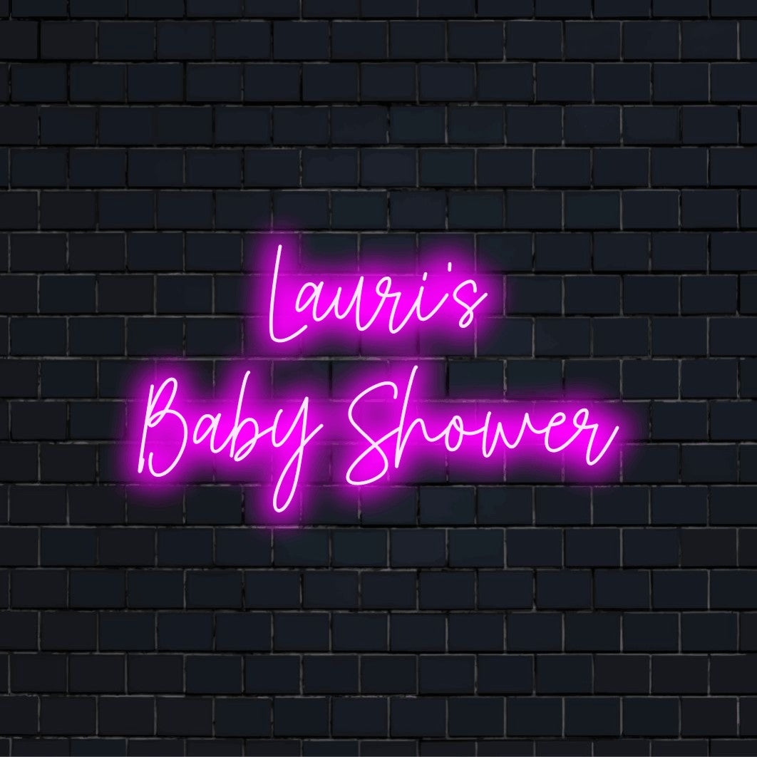 Lauri_s Baby Shower Personalized LED Neon Sign, bright neon lettering against black brick wall
