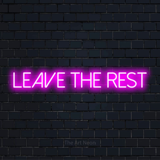 "Leave The Rest" neon text design on a black brick wall