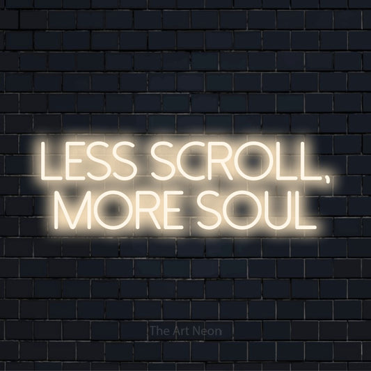 "Less Scroll, More Soul" glowing LED neon sign on a black brick wall
