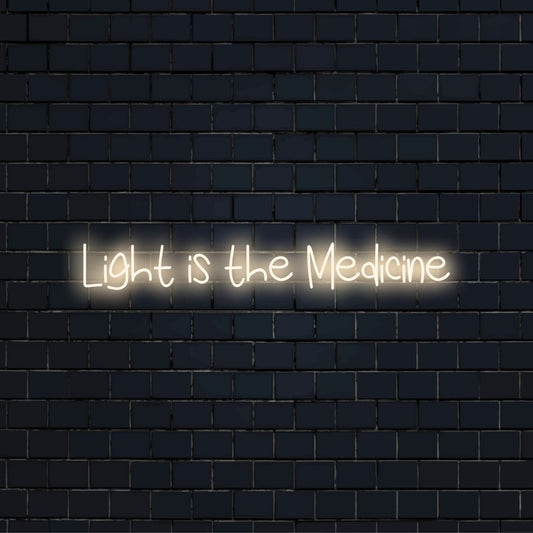 Light Is The Medicine Neon Sign, bright LED glow against black brick wall