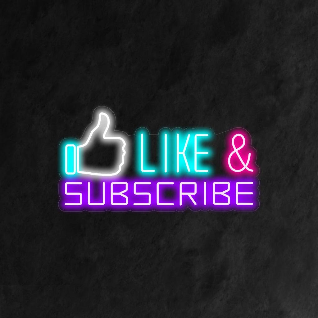 A dynamic neon sign featuring the words 'Like' and 'Subscribe' accompanied by a hand symbol, representing engagement and support in the world of social media. 