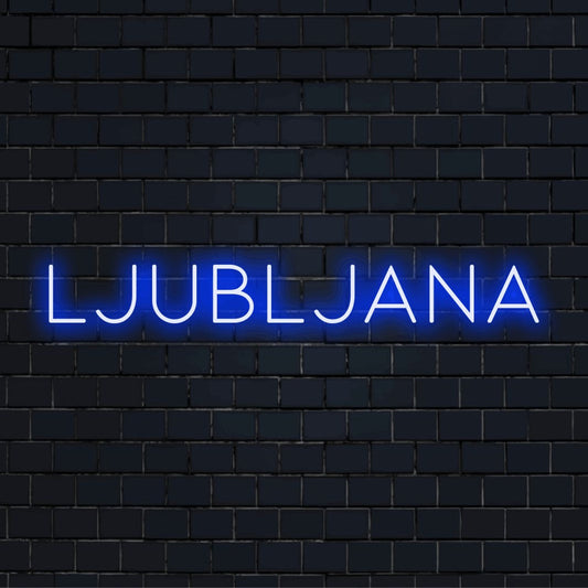 Ljubljana Neon Light with neon text light on dark brick wall