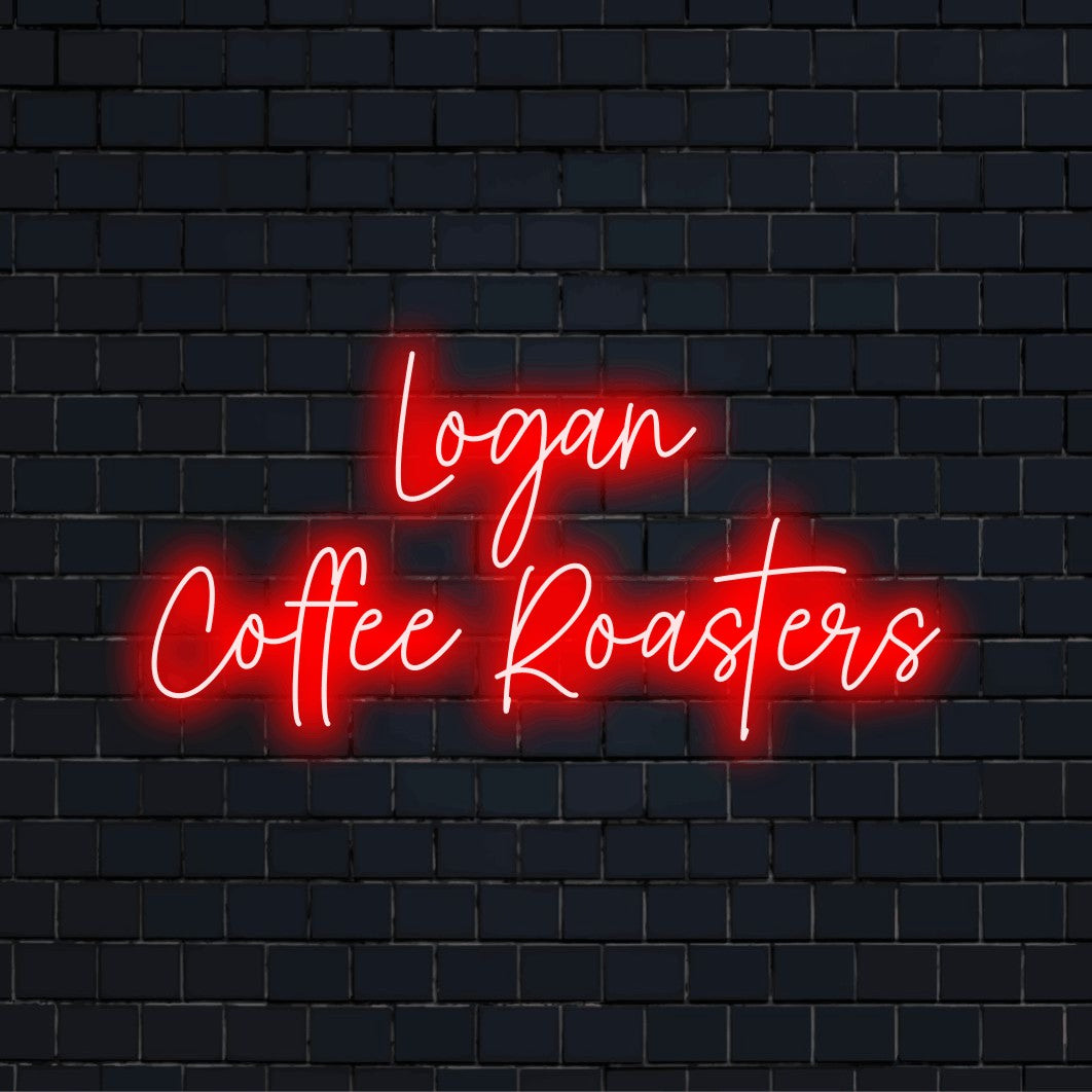 Logan Coffee Roasters Custom Name Neon Sign, neon text light on dark brick background