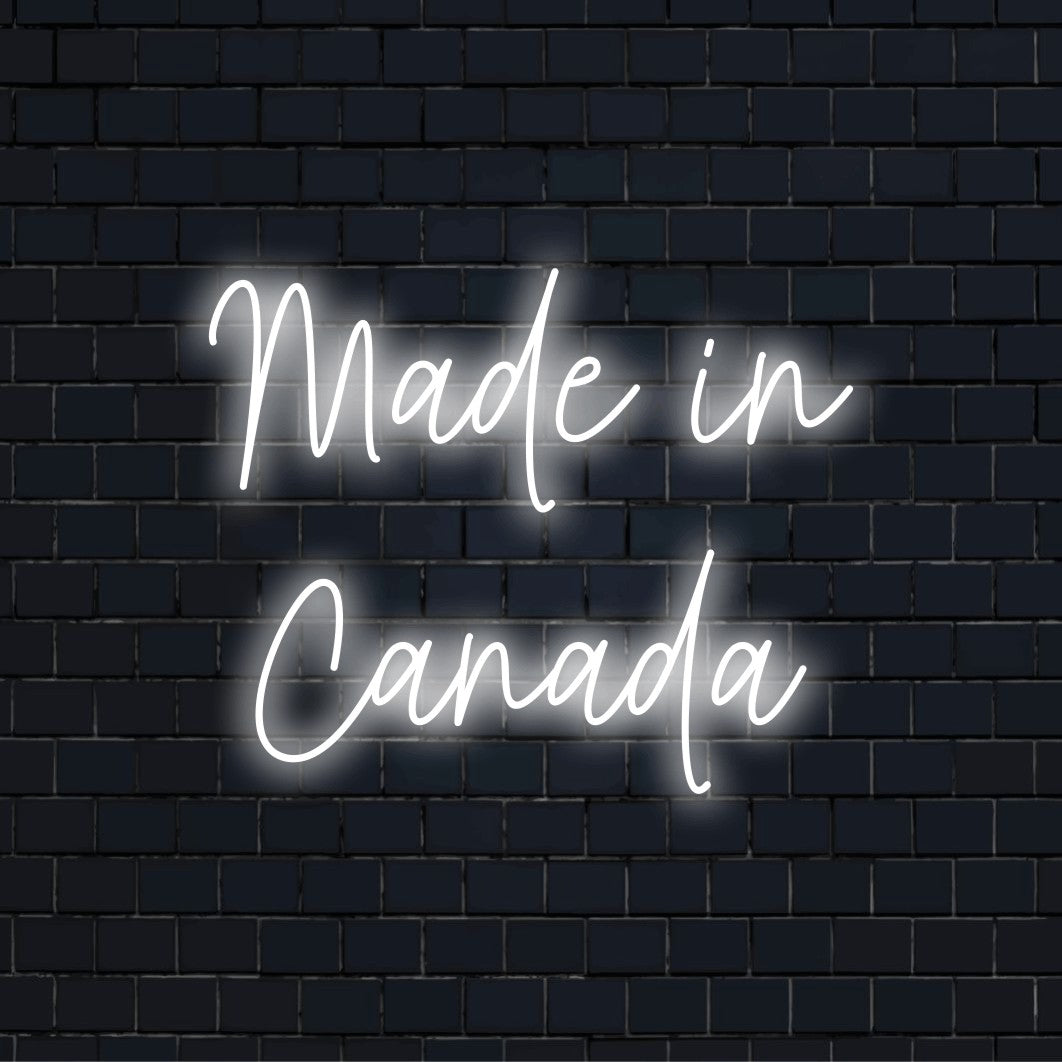 Made In Canada LED Neon Sign, glowing lettering on black brick background