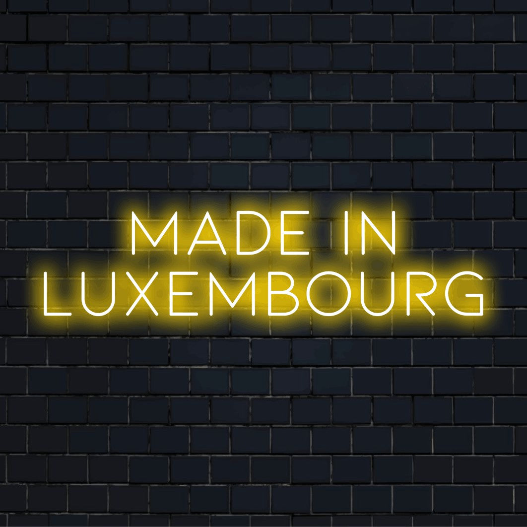 Made In Luxembourg Neon Sign, glowing neon text on dark brick background