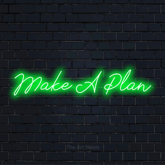 "Make A Plan" script-style LED neon sign on a black brick wall