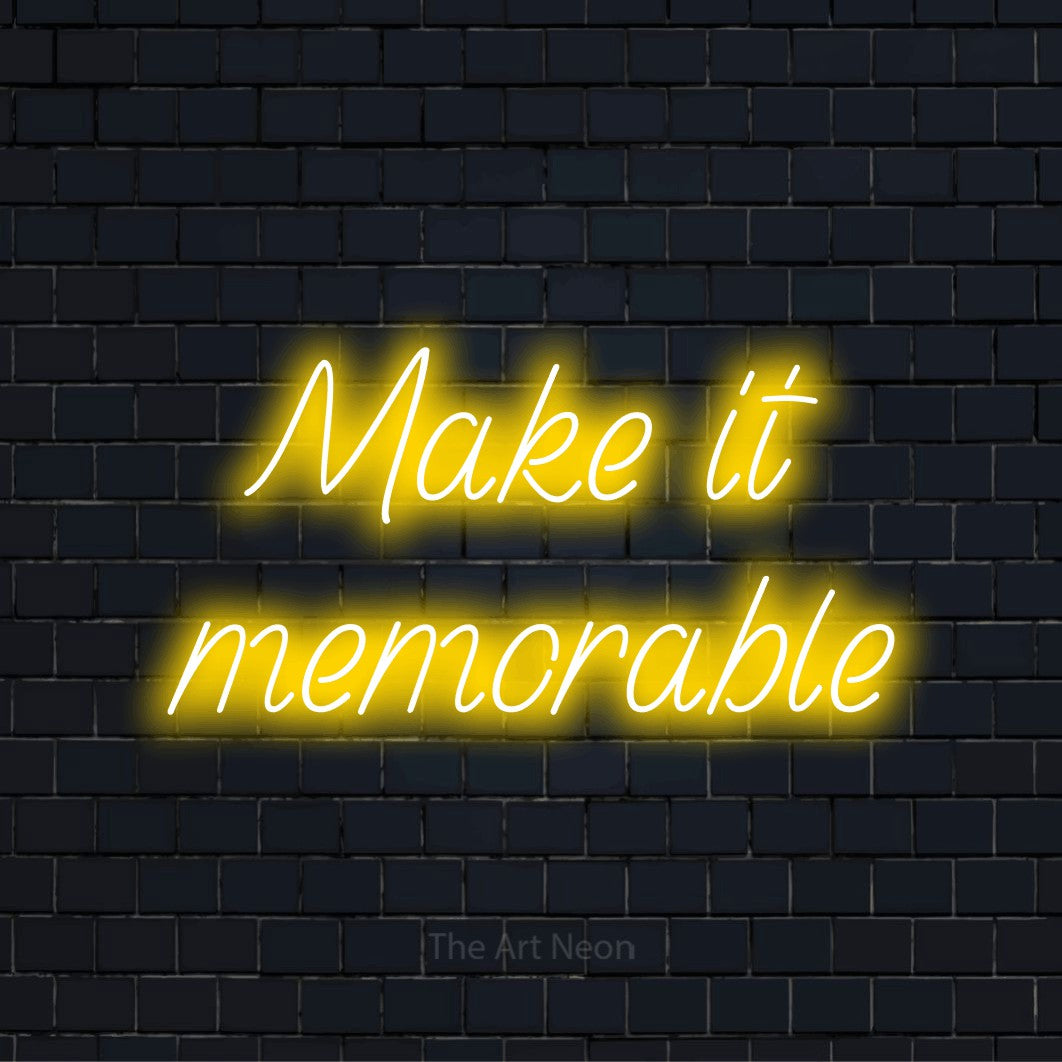 "Make It Memorable" glowing LED neon sign on a black brick wall