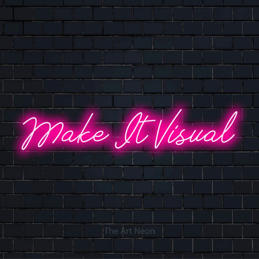 "Make It Visual" neon text design on a black brick wall