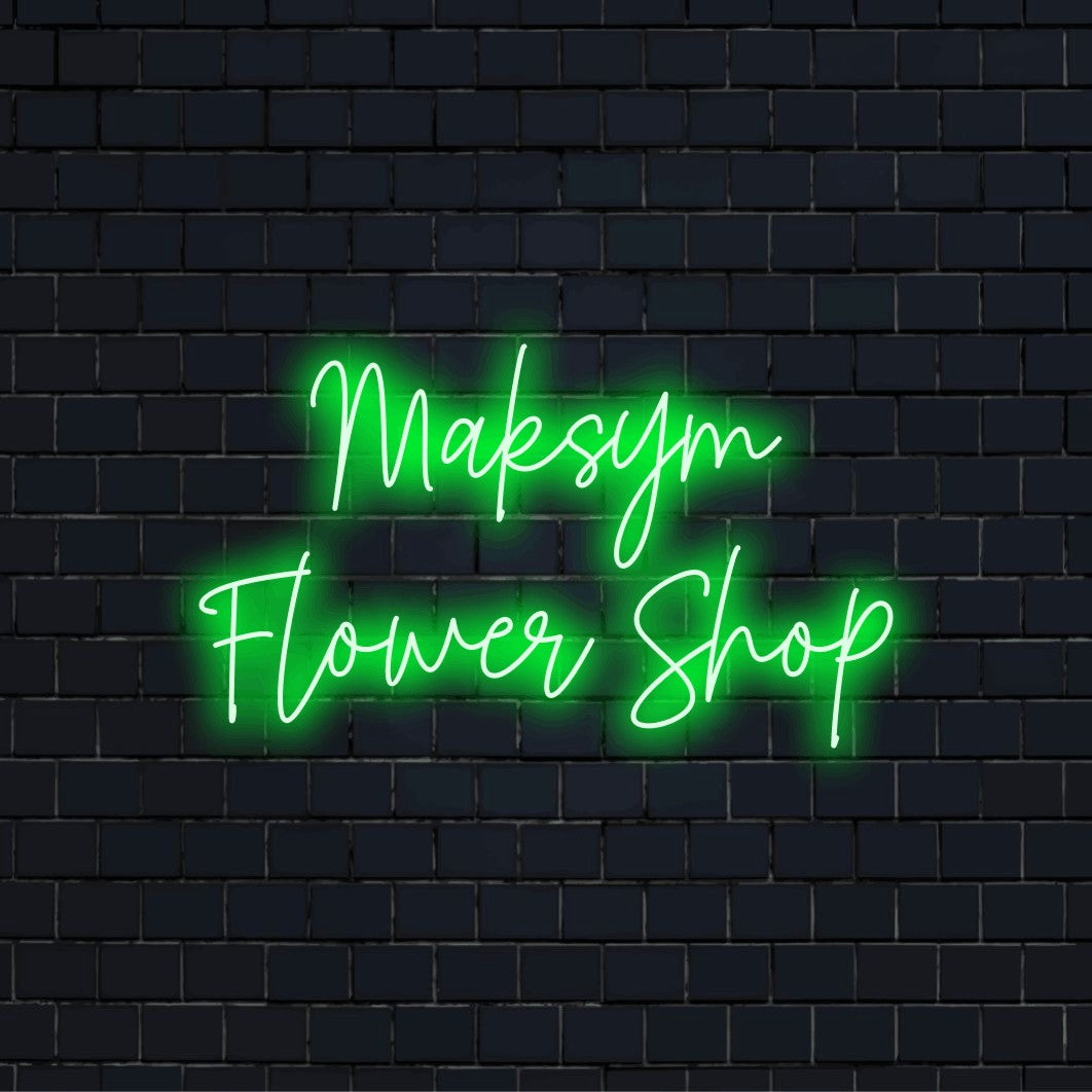 Maksym Flower Shop Custom Name Neon Sign, neon text light against black brick wall