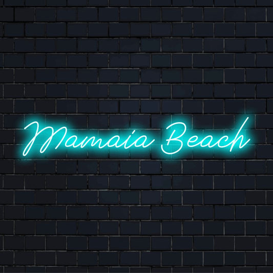 Mamaia Beach LED Neon Sign, neon text light against black brick wall