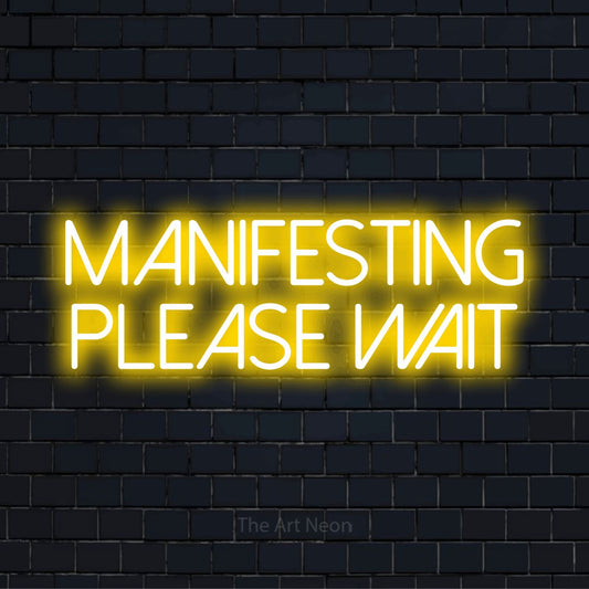 "Manifesting… Please Wait" neon text design on a black brick wall