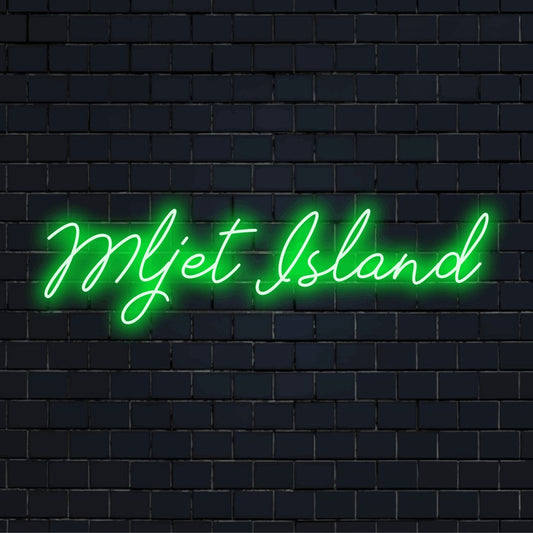 Mljet Island Neon Sign, bright neon lettering against black brick wall