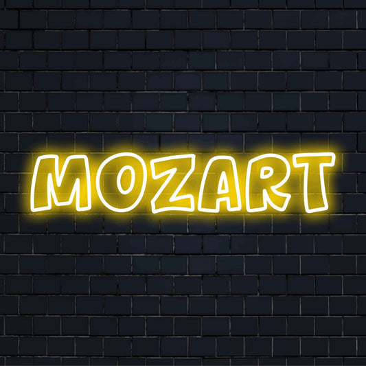 Mozart LED Neon Sign, glowing lettering against black brick wall