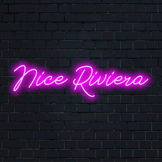 Nice Riviera LED Neon Sign, glowing neon text against black brick wall