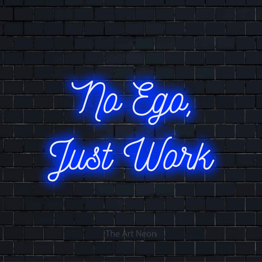 "No Ego, Just Work" glowing LED neon sign on a black brick wall