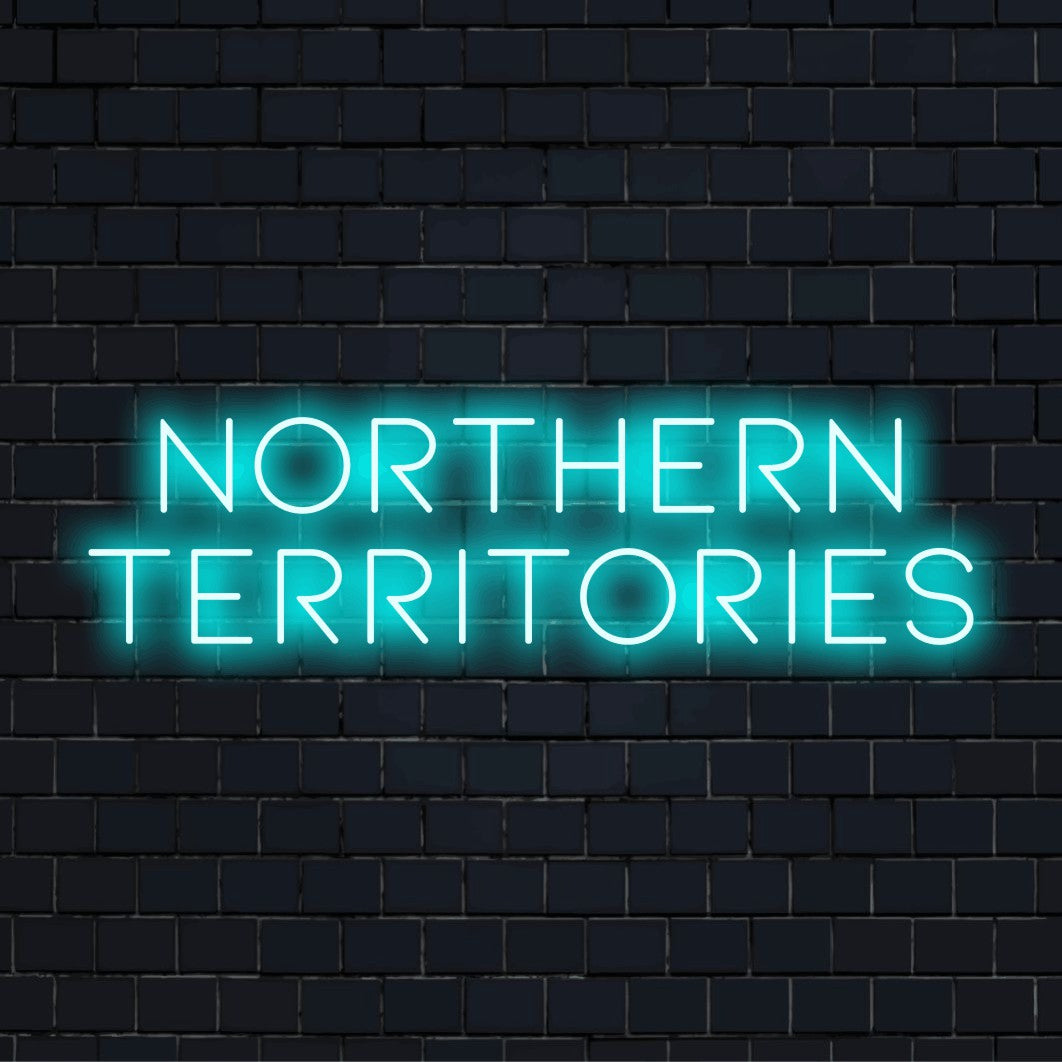 Northern Territories Neon Sign, glowing neon text against black brick wall
