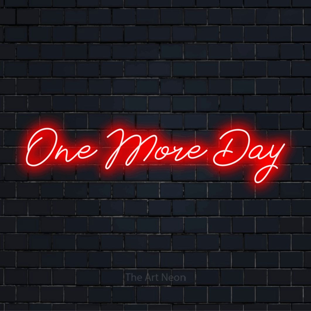 "One More Day" script-style LED neon sign on a black brick wall