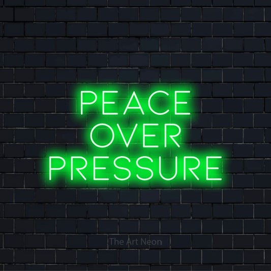 "Peace Over Pressure" neon text design on a black brick wall