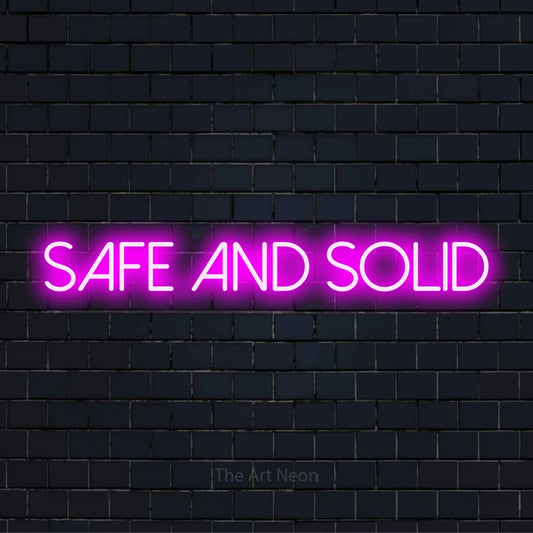 "Safe And Solid" text design with neon effect on a black brick wall