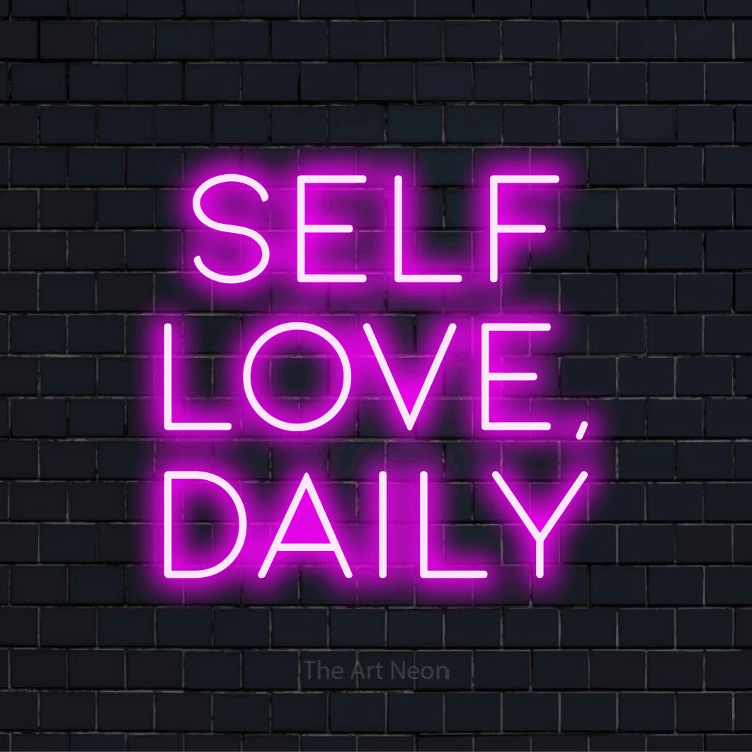 "Self Love, Daily" text design with neon effect on a black brick wall