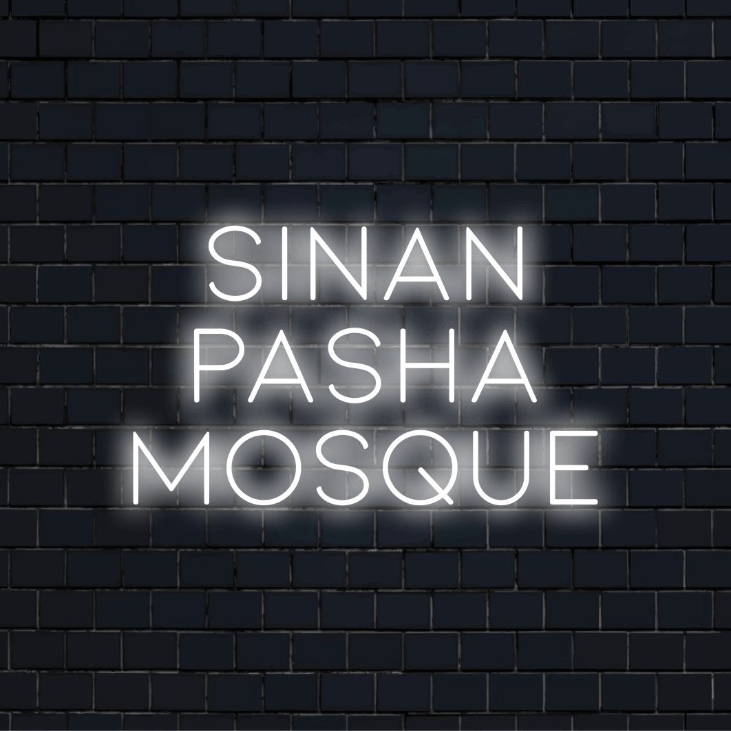 Sinan Pasha Mosque Neon Light with bright neon lettering on black brick background