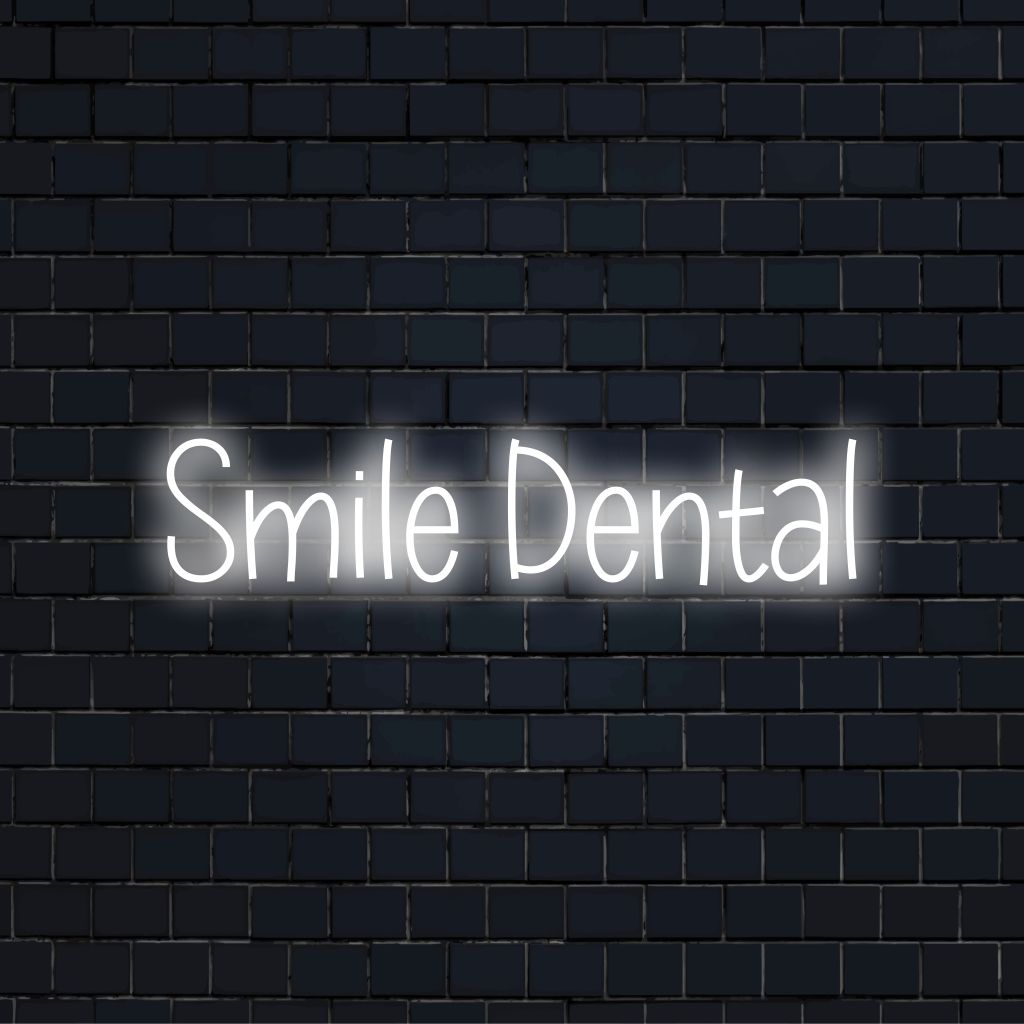 Smile Dental LED Neon Sign, bright neon lettering against brick backdrop