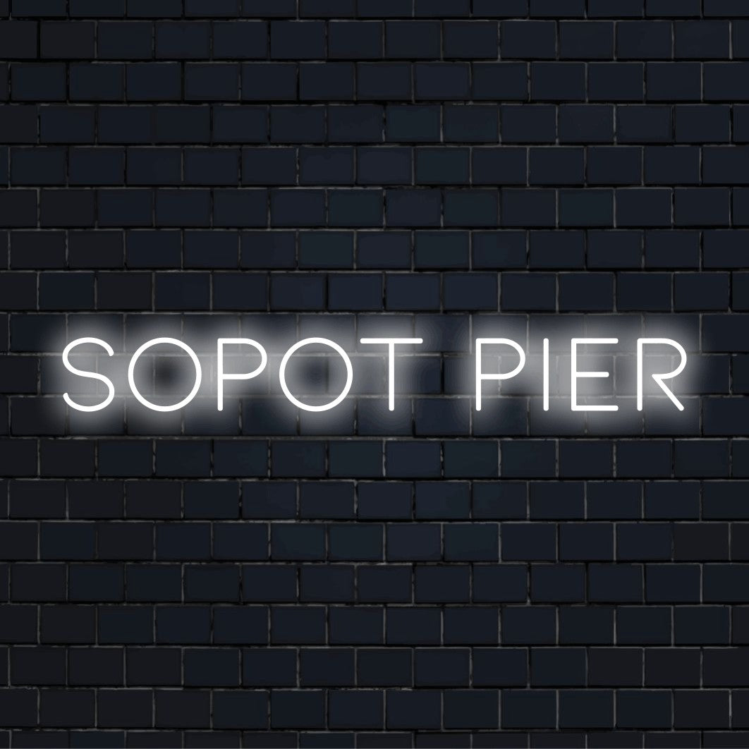 Sopot Pier Neon Light with neon text light on dark brick wall