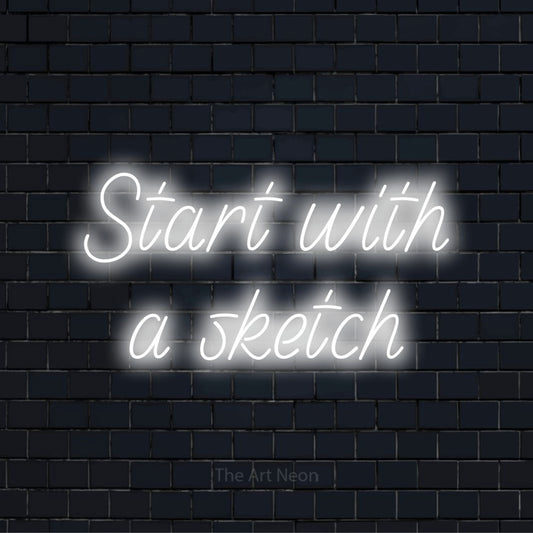 "Start With A Sketch" neon text design on a black brick wall
