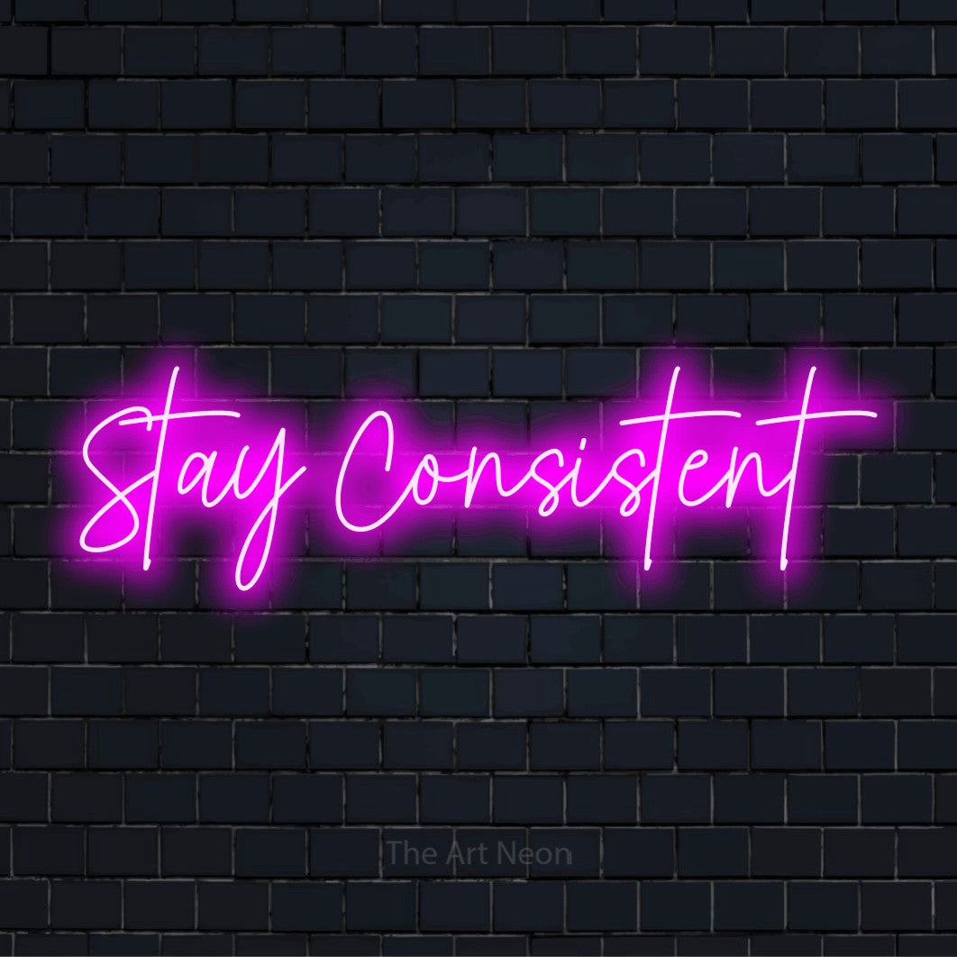 "Stay Consistent" LED neon sign on a black brick wall
