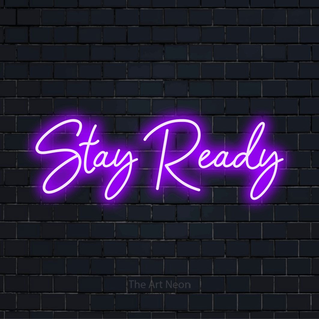 "Stay Ready" neon text design on a black brick wall