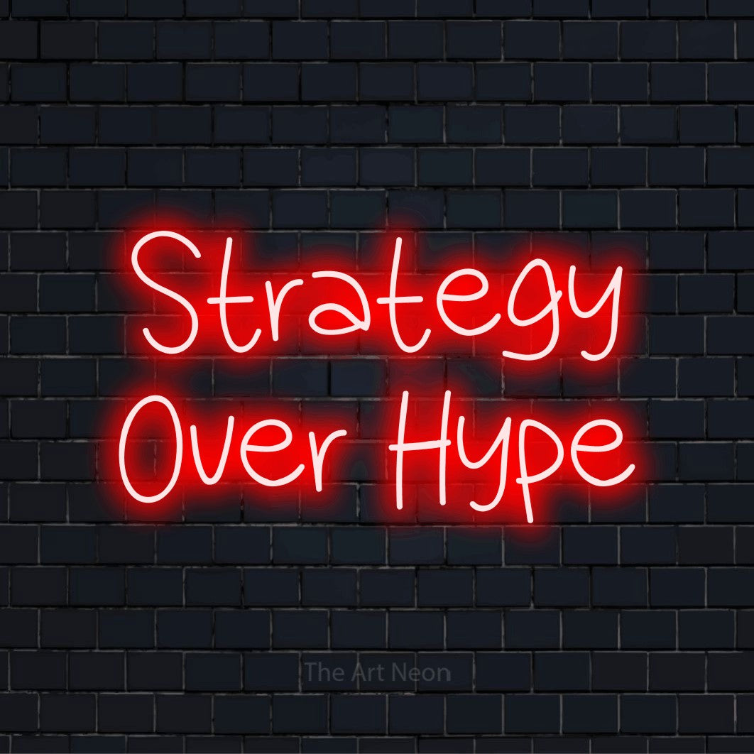 "Strategy Over Hype" text design with neon effect on a black brick wall