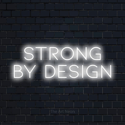 "Strong By Design" text design with neon effect on a black brick wall