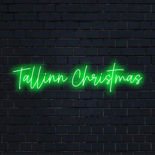 Tallinn Christmas Neon Sign, glowing neon text on dark brick wall