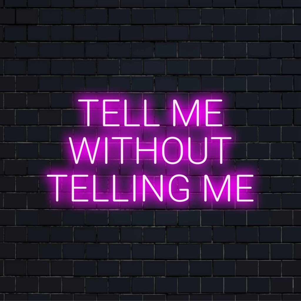 Tell Me Without Telling Me Neon Sign, bright neon glow against brick backdrop