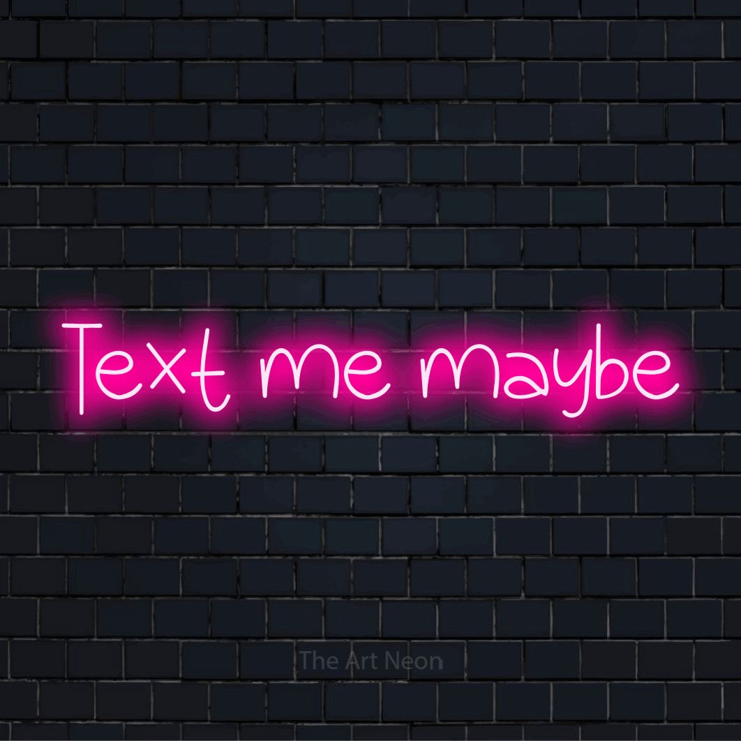 "Text Me Maybe" neon text design on a black brick wall