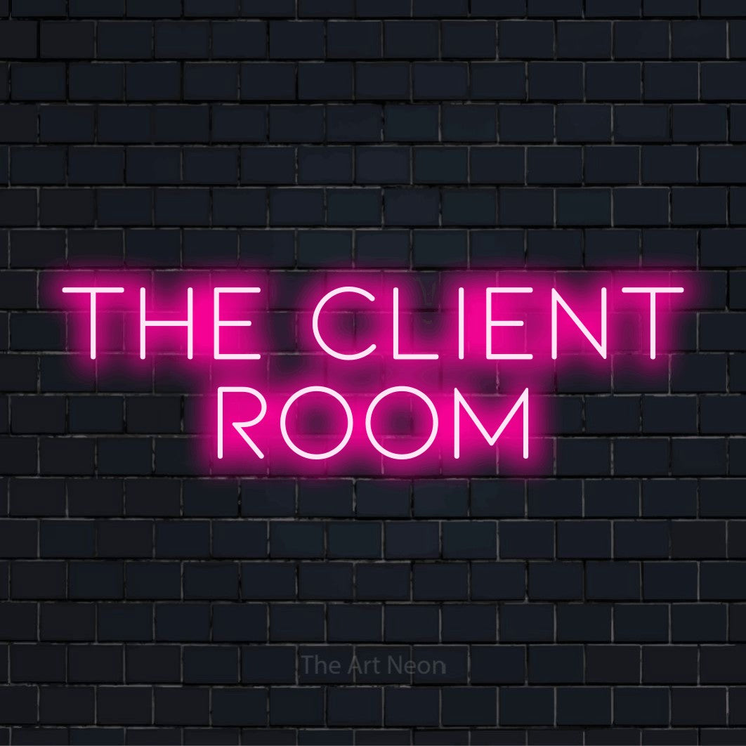 "The Client Room" script-style LED neon sign on a black brick wall
