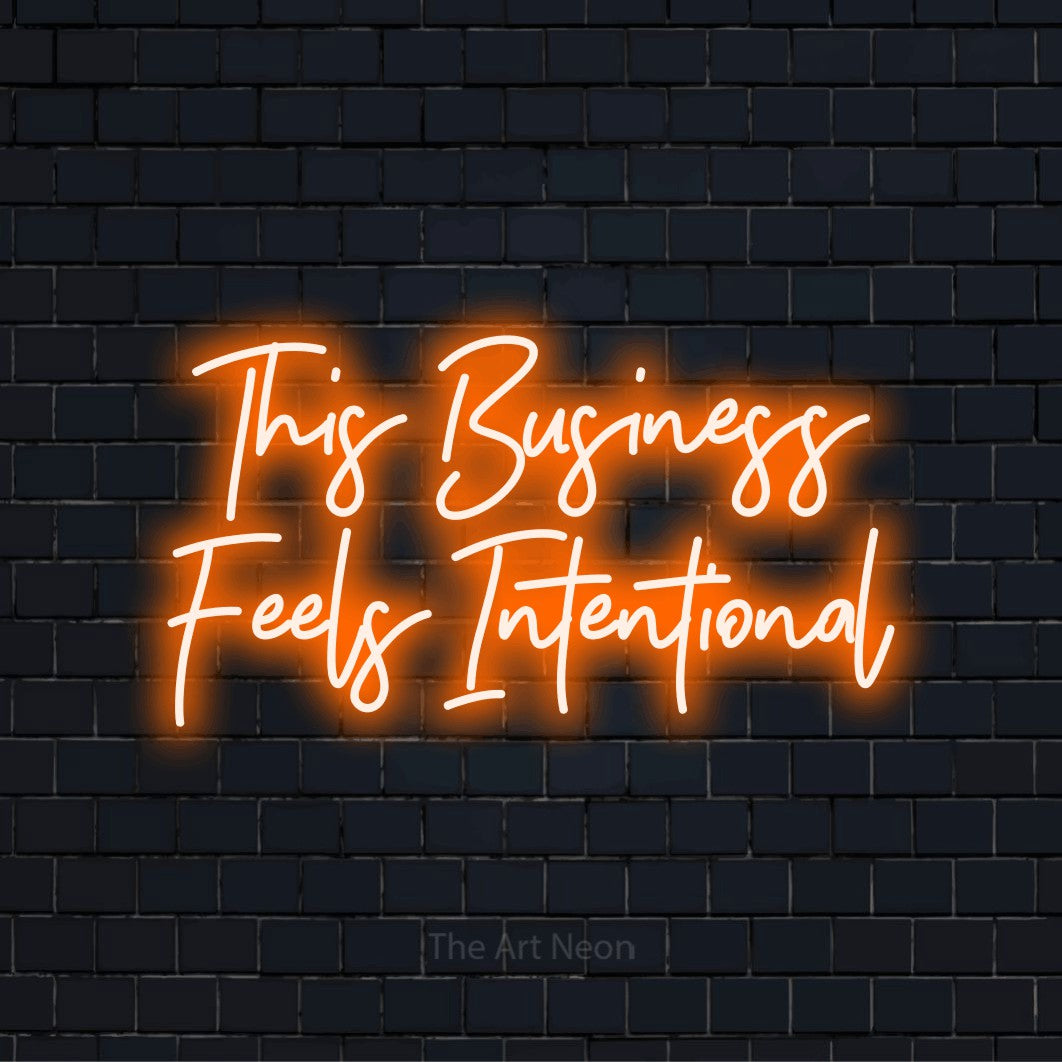"This Business Feels Intentional" text design with neon effect on a black brick wall