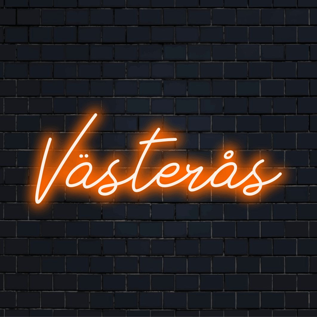 Vasteras LED Neon Sign, glowing lettering against black brick wall