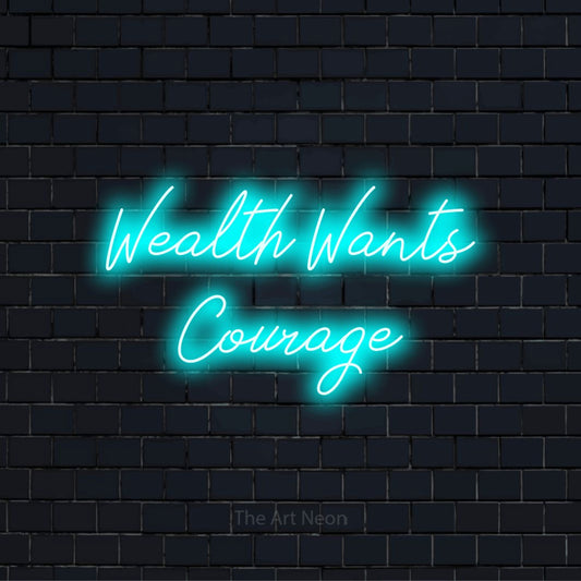 "Wealth Wants Courage" LED neon sign on a black brick wall