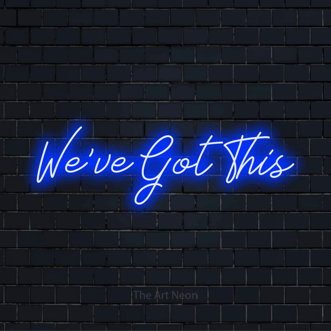 "We’ve Got This" script-style LED neon sign on a black brick wall