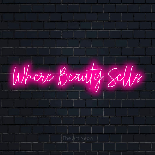 "Where Beauty Sells" neon text design on a black brick wall
