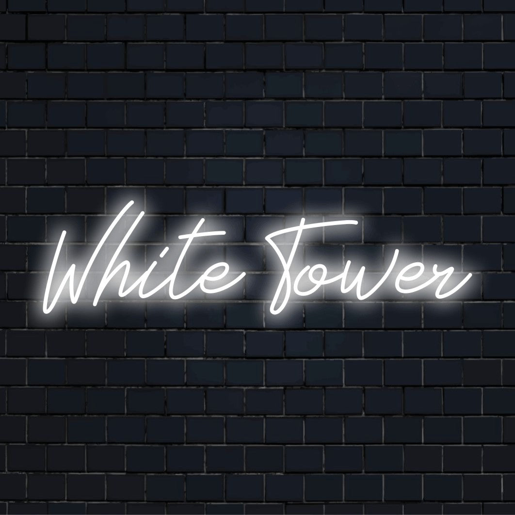 White Tower LED Neon Sign, bright LED glow against black brick wall