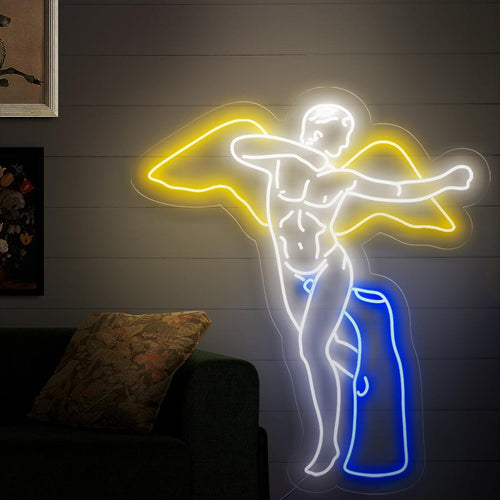 En fängslande neonskylt med staty för Winged Man, med en dynamisk skulptur av en man med vingar.