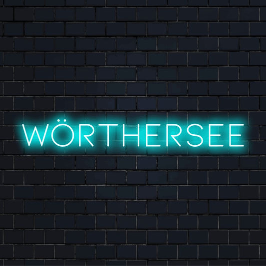 Worthersee Neon Sign, glowing lettering on dark brick wall