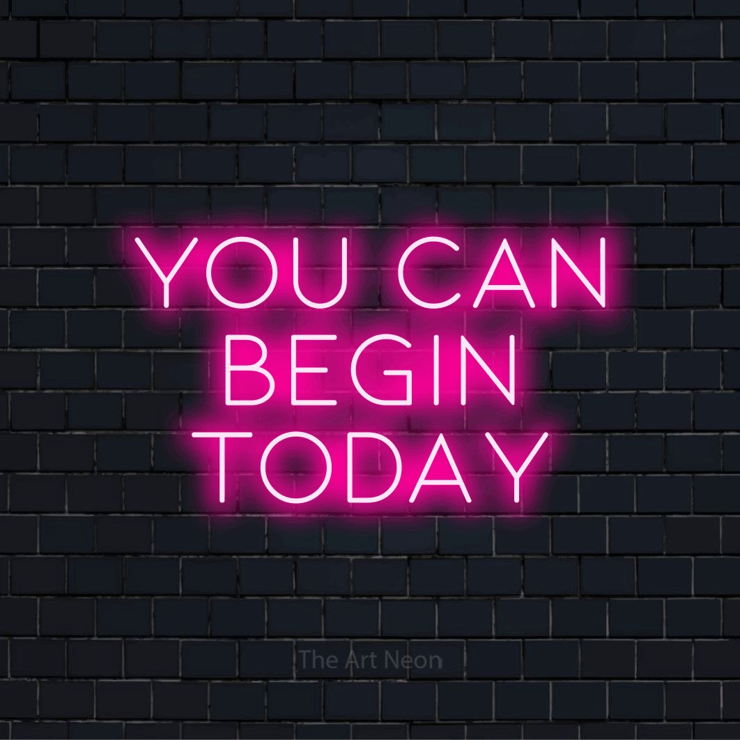 "You Can Begin Today" text design with neon effect on a black brick wall